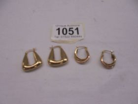 Two pairs of gold hoop earrings, 4.6 grams.