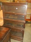 A four tier Globe Wernick book case. COLLECT ONLY.