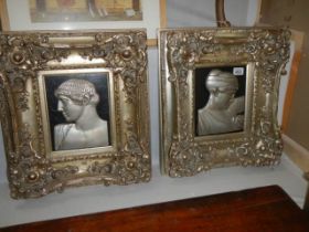 A pair of gilt framed embossed Roman heads, COLLECT ONLY.