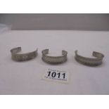 Three Jorgen Jensen pewter cuffs (Nos 150, 168 and 185).