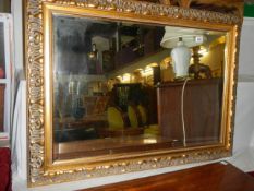 A gilt framed bevel edged mirror, COLLECT ONLY.