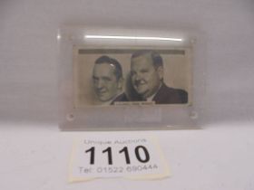 A Laurel and Hardy card signed on back Stan Laurel & Oliver Hardy.