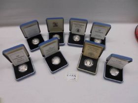 Eight cased silver proof one pound coins.