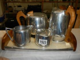 A four piece retro tea set on tray.