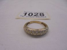A yellow gold multi-stone cushioned ring, size L, 2.1 grams.