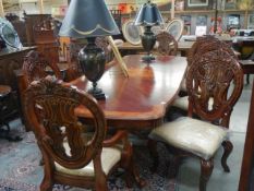 A mahogany extending dining table with an extra lead and a set of 8 dining chairs, COLLECT ONLY.