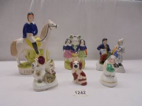 Six 19th century Staffordshire figures including a horse with rider and an archer.