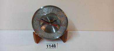 A metal Thai/Chinese clock with reief designs (battery operated)