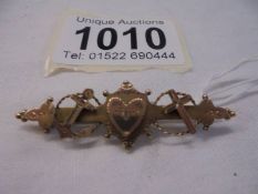 An Edwardian 9ct gold brooch with a heart, cross & anchor depicting Faith, Hope & Charity, 2 grams.