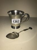 A silver beaker & silver cake spoon