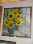 A mid 20th century gilt framed painting of sunflowers, signed but indistinct. COLLECT ONLY.