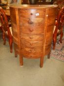 A solid teak bow front chest of drawers, 80 x 40 x 106 cm high, COLLECT ONLY.