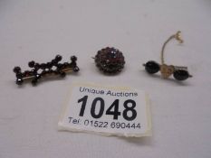 Three antique garnet brooches set in yellow metal (one with centre heart design)