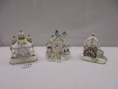 Three Coalport cottage pastille burners - 'Park Lodge', 'The Bell Tower', and 'The Watermill'.