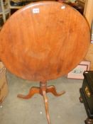 A circular mahogany tip top table, 75cm diameter. COLLECT ONLY