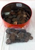 A tin of pennies of 1/2 pennies