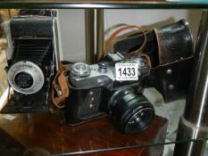 A Coronet Rapide folding camera and one other.