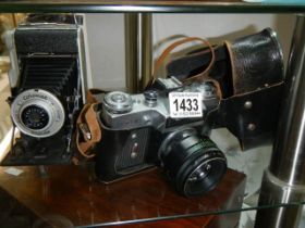 A Coronet Rapide folding camera and one other.