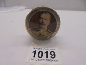 A silver plated pill box featuring an image of a military figure.