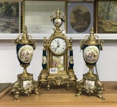 A Brass clock set with Porcelain columns and panels, Quartz movement