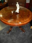 A Victorian mahogany oval table on bird cage base with splay legs, COLLECT ONLY.