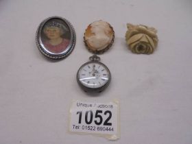 A silver fob watch, mid century portrait miniature in oils in silver frame, a brooch/pendant cameo