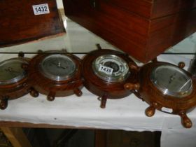 Four ships wheel barometers.