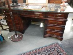 A good quality mahogany double pedestal desk with glass top, COLLECT ONLY.