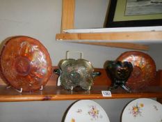 Two carnival glass 'Marigold' bowls and two other pieces of carnival glass.