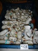 A good mixed lot of porcelain boots and shoes including crested examples. COLLECT ONLY.