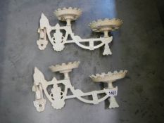 A pair of cast iron swivel wall brackets.