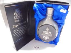 A boxed decanter of Dimple Royal Holland 12 year old whiskey.