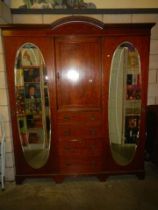 A Victorian mahogany inlaid combination wardrobe with oval mirrors on doors. COLLECT ONLY.