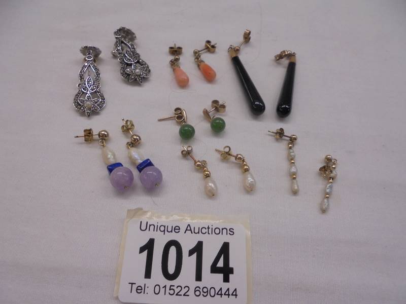 Six pair of 9ct gold earrings (coral/pearl etc.,) and a pair of marcasite earrings.