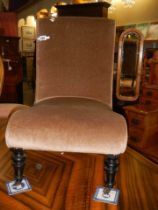 An Edwardian nursing chair in castors, COLLECT ONLY.