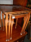 A nest of three figured mahogany tables, COLLECT ONLY.