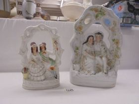 Two 19th century figures of courting couples.