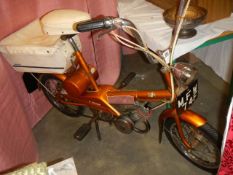 A 1968 Raleigh Wisp Moped with VE60, 1974 tax disc, owners handbook etc., COLLECT ONLY.