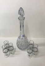 A tall cut glass decanter and six glasses. COLLECT ONLY.