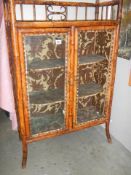 A late Victorian bamboo display cabinet (one piece of glass missing) COLLECT ONLY.