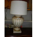 A nice ceramic urn shaped table lamp.