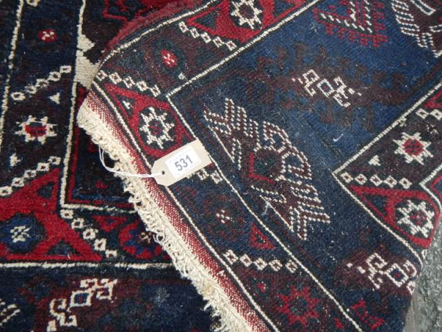 A good old rug in a blue and red pattern, 76 x 50 inches. COLLECT ONLY. - Image 4 of 5