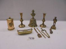 A mixed lot of miniature brass ware including fender, fire irons, candlesticks etc.,