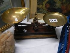 A set of old brass kitchen scales.