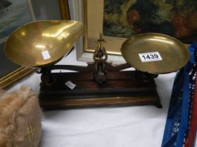 A set of old brass kitchen scales.