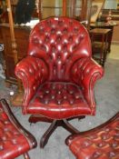 A Good quality deep buttoned swivel chair in red, COLLECT ONLY.