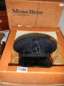 A vintage chauffeurs cap in a Moss Bros box with original bill of sale.