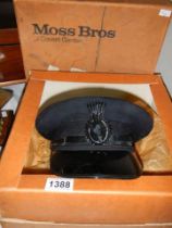A vintage chauffeurs cap in a Moss Bros box with original bill of sale.