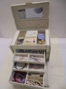 A vintage jewellery box and a mixed lot of costume jewellery.