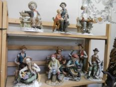 Two shelves of ceramic tramp figures, COLLECT ONLY.